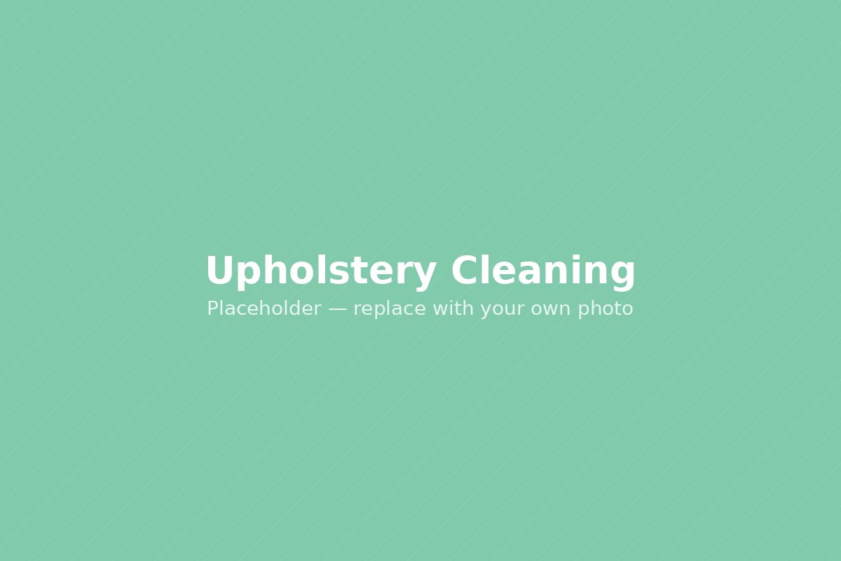 Upholstered chair being steam cleaned